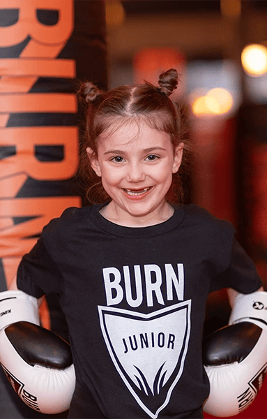 young kid training at Burn Kickboxing